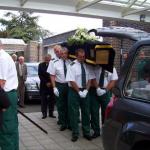 Service Personnel Carry the Coffin into the Chapel.