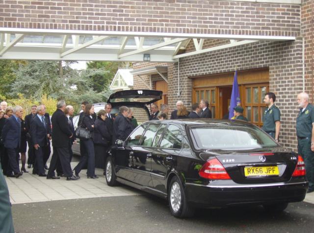 Colleagues file past the Coffin.