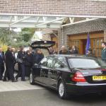 Colleagues file past the Coffin.