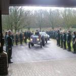 A Tractor Carries the Coffin.