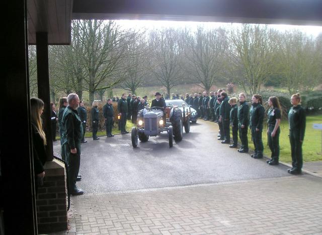 A Tractor Carries the Coffin.