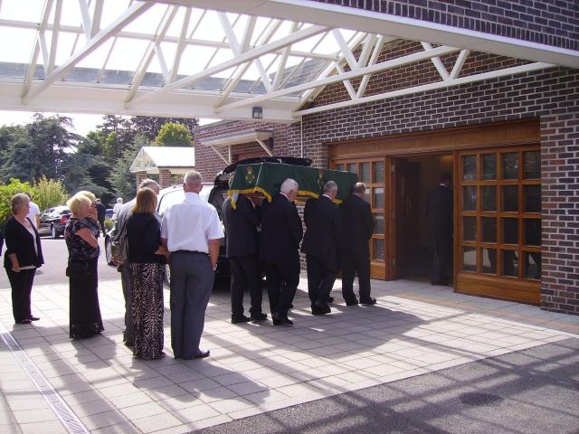 Mourners follow the coffin into the Chapel.